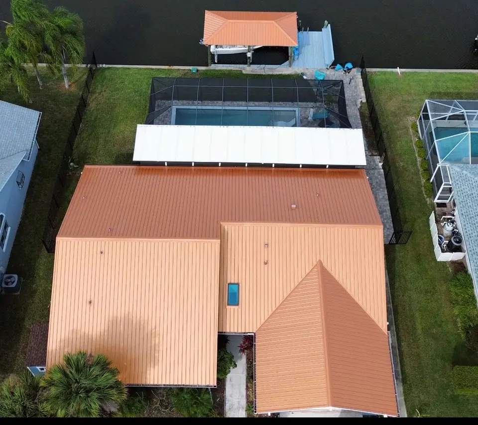 Copper Penny standing seam roof on a waterfront house